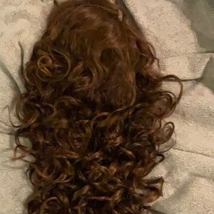 It’s a Wig! Brand made by SLI Production Corp. Brown wig with highlights